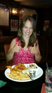 Suzanne gives two thumbs up to her fish and chips.