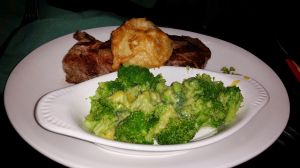 Rib-eye steak, steamed broccoli, deep-fried mushroom.