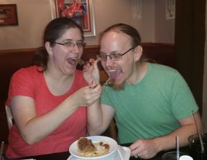 Kira and Erik feeding each other pecan pie at Bobby's Colorado Steakhouse